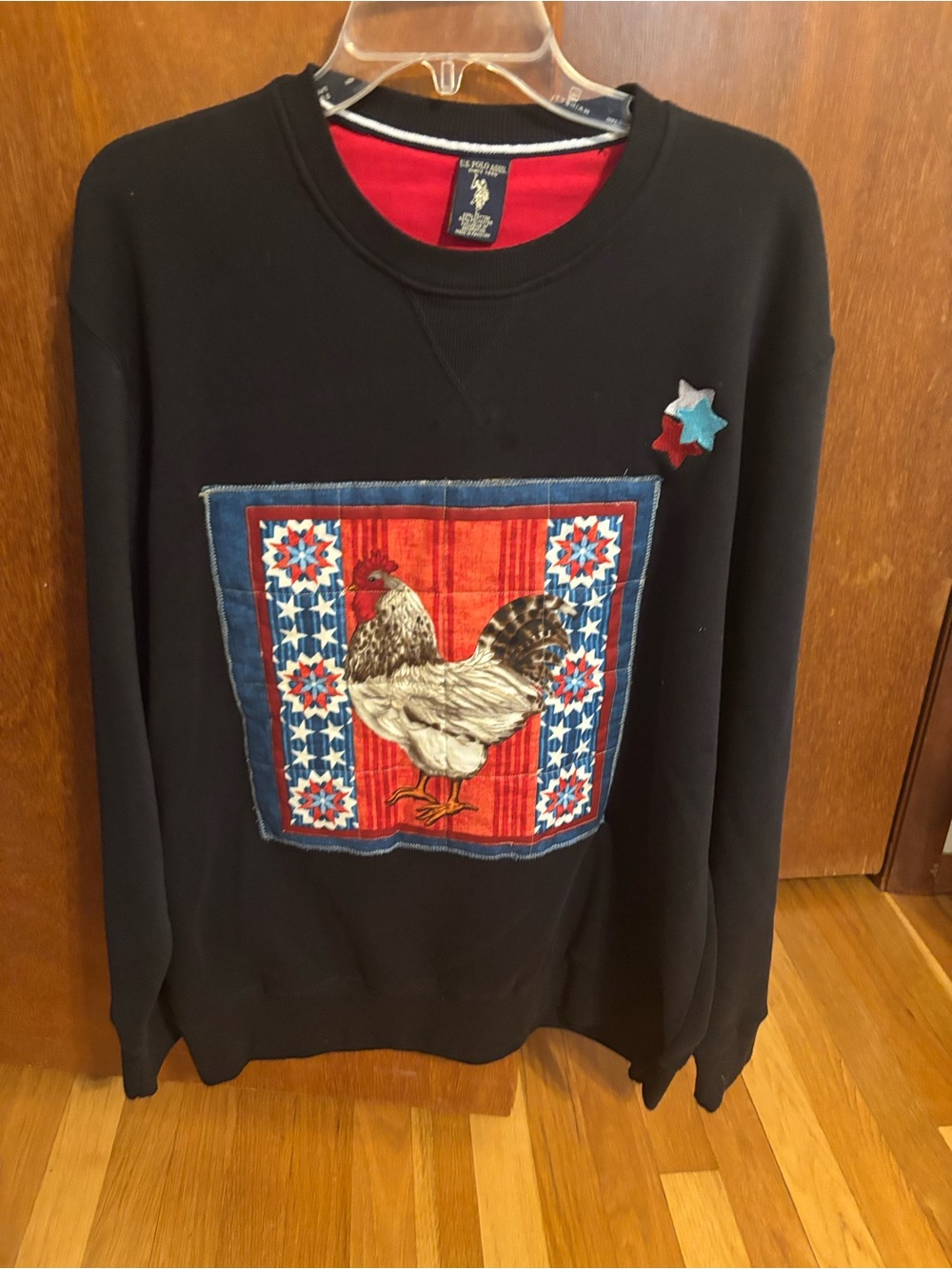 U.S. Polo Assn. Black Crewneck Sweater with Red, Blue and White Rooster Patch